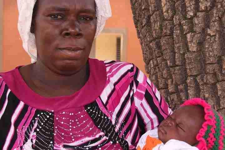 Asseta Kaboré holding her baby