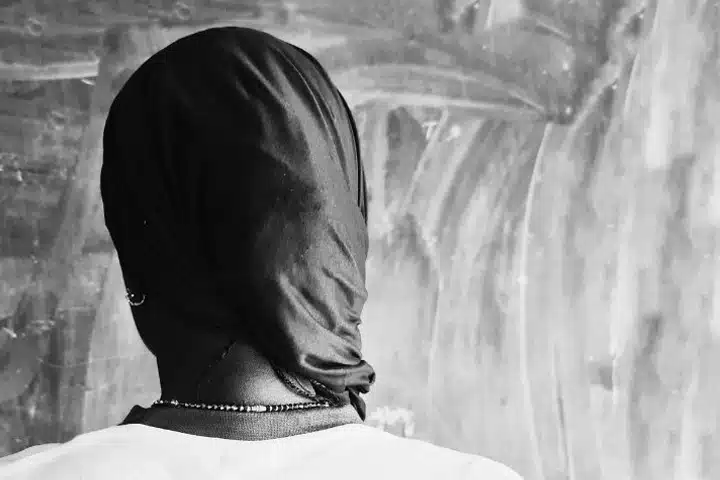 Dressed modestly in a T-shirt, skirt and black headscarf, Mounia