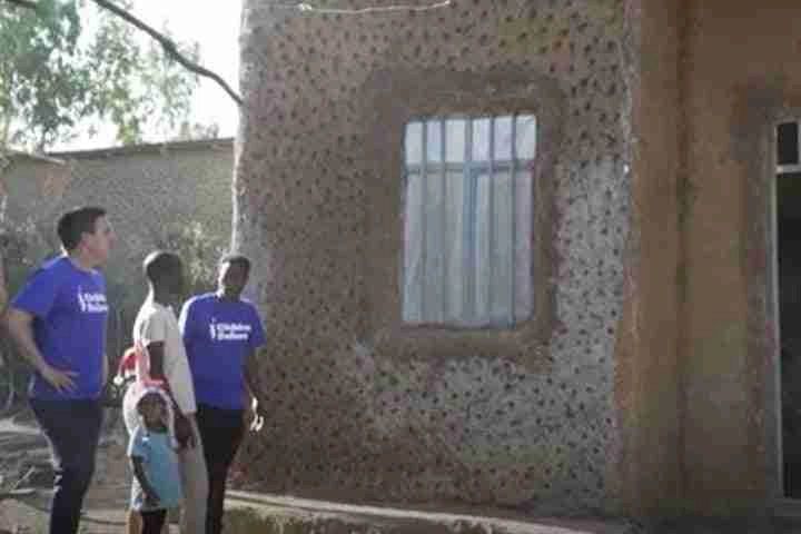 People standing infront of house