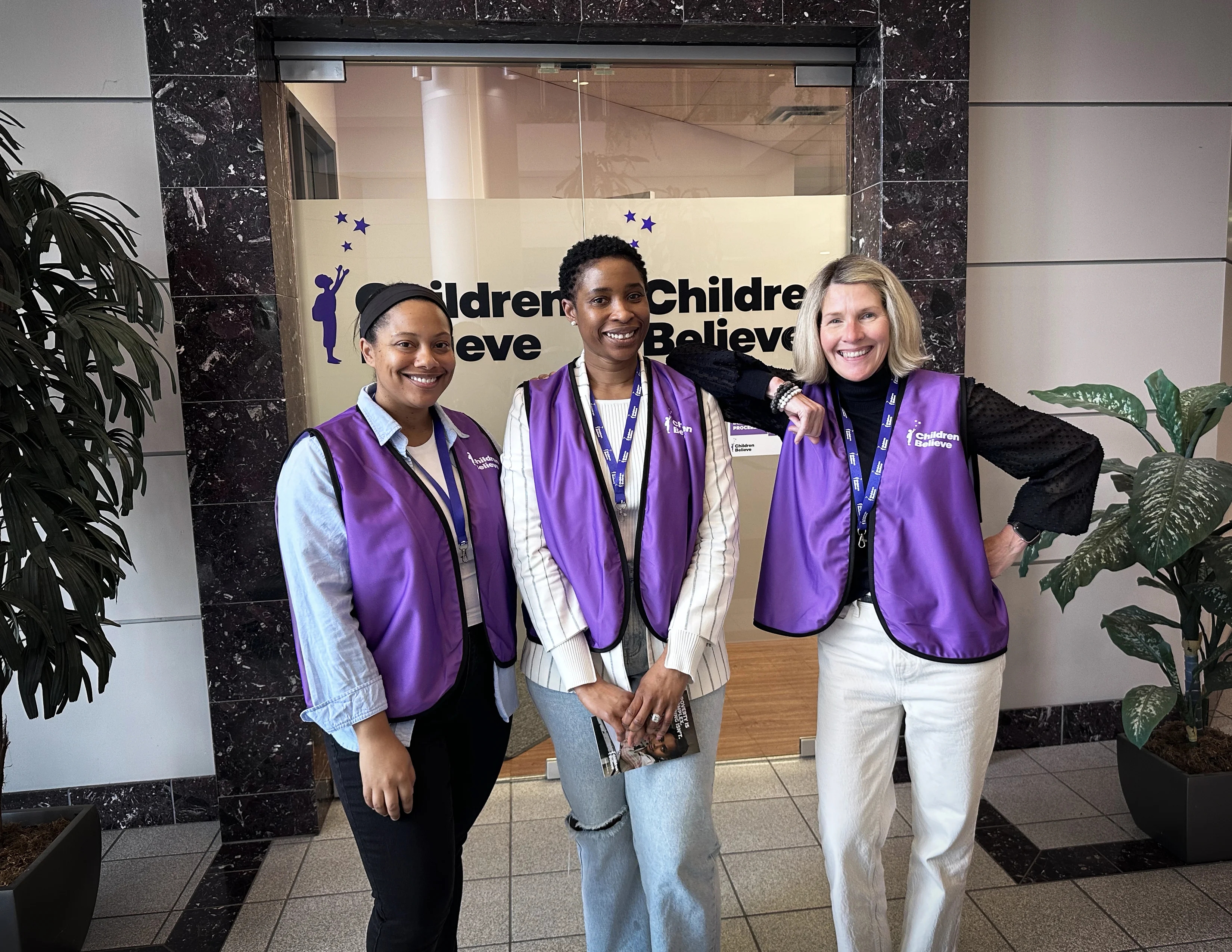 Children Believe staff as canvassers smiling