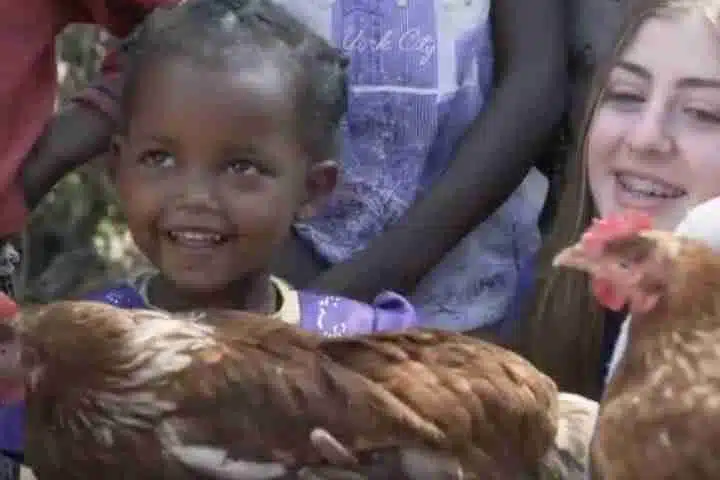 Picture of kid with Chicken