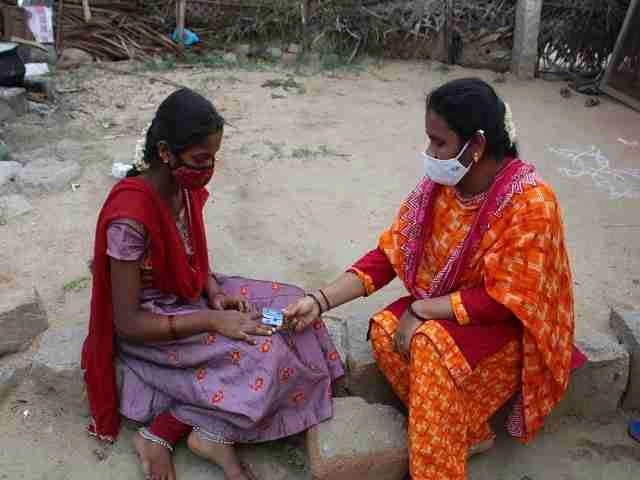 Women in India holding hands