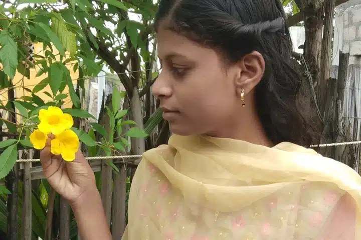 Kiroshini holding yellow flowers
