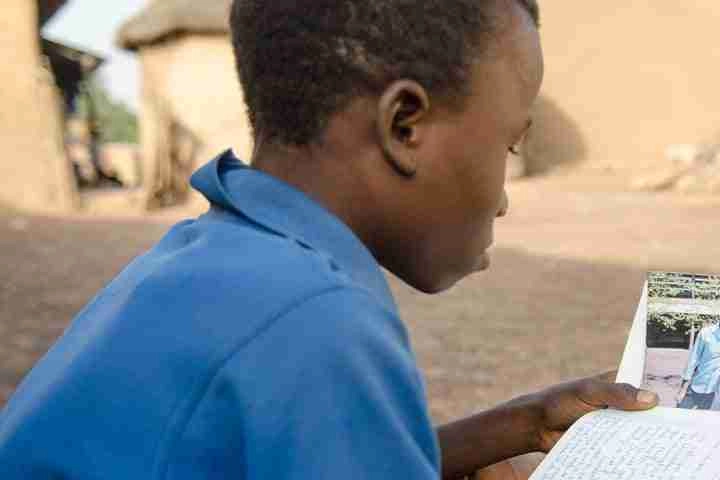 Boy reading letter