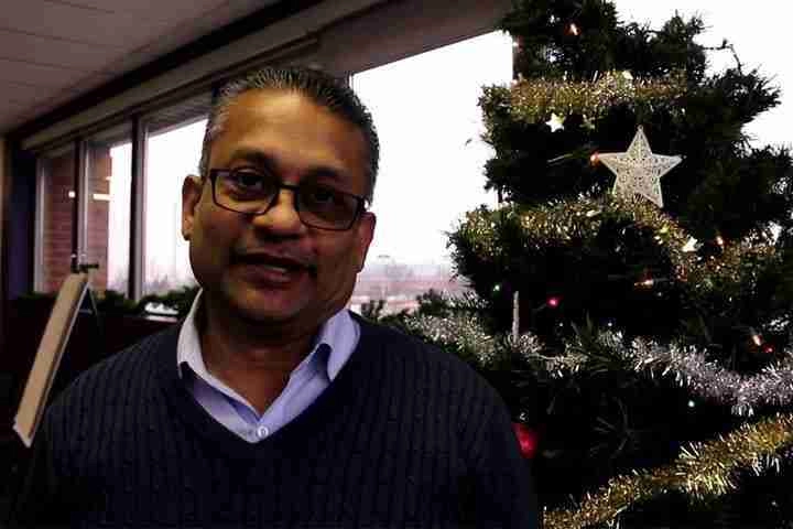 Patrick in front of Christmas tree